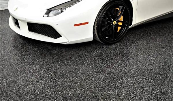 White car on gray full-chip garage floor coating